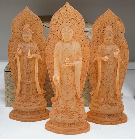 A set of three large Chinese glass figures of Bodhisattva, rust finish, with cases, 42cm high. Condition - good